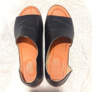 Flat slip on open toed shoes